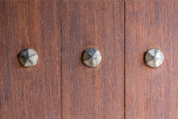 Obraz na płótnie Canvas Vintage Copper nails in the door.