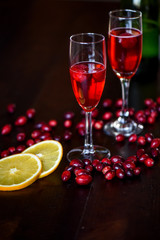 Raspberry Mimosa with blood orange on dark wood background