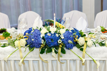 festive table decorated with flowers. The decor of Hydrangea, lilies and roses