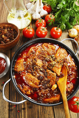 Pork stew with tomatoes and raisins