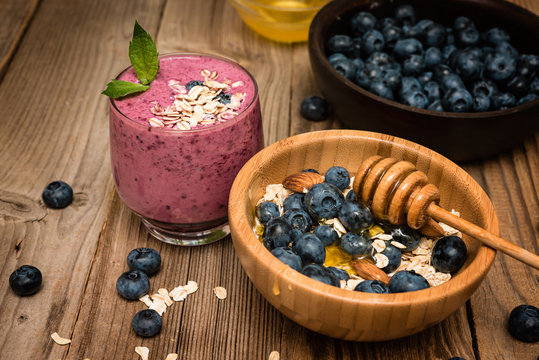 Healthy breakfast, granola and yogurt, fresh berries on rustic background.  granola and musli.