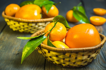 mandarins and oranges on the wooden background
