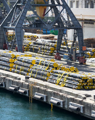 new pipes in the industrial port, cargo cranes and infrastructure