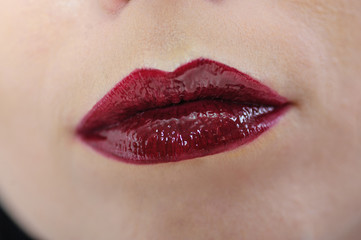 Naklejka premium beautiful female lips with red lipstick make up
