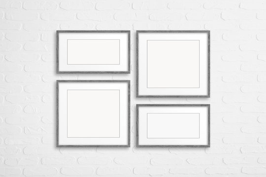 Collage of blank photo frames on bricks textured wall, decor mock up