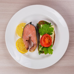 Delicious steak fillet red salmon fish on a plate.