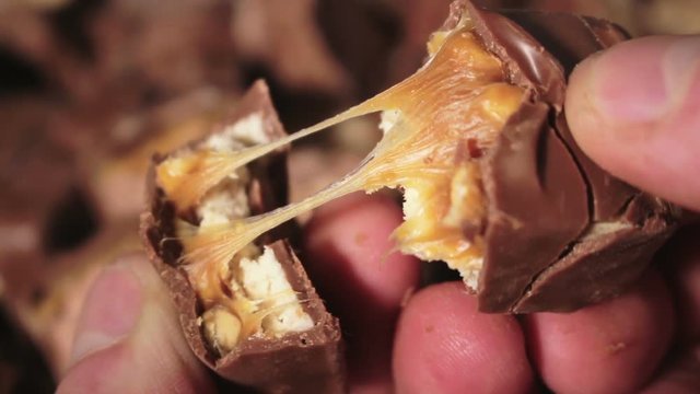Man Breaks A Chocolate Bar