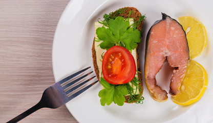 Delicious steak fillet red salmon fish on a plate.