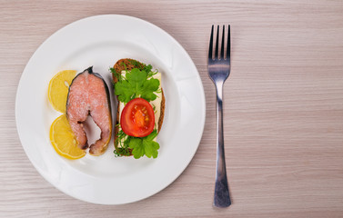 Delicious steak fillet red salmon fish on a plate.