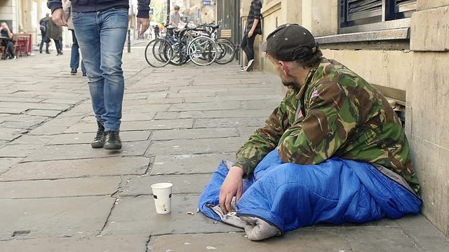 Homeless receive charity in the street 