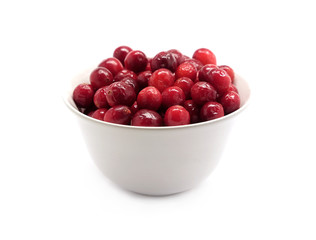 Cranberries in round white bowl isolated on white background indoor front view close up