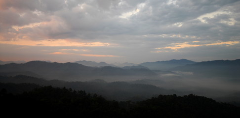 mountains with fog in the valleys
