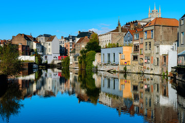 Ghent, Belgium. A beautiful reflection of downtown Ghent with the Belfry tower peaking out above the authentic houses in the city center of Ghent, Belgium.