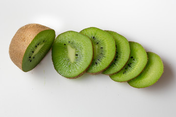 Fresh sliced kiwi fruit on white background. Space for text.