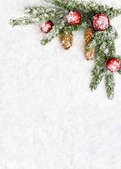 Obraz na płótnie Canvas Christmas decoration. Branch christmas tree, christmas balls and cones spruce on snow. Top view, flat lay