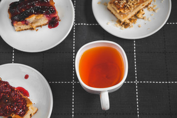 Hot tea with lemon and slices of pie