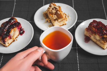 Hot tea with lemon and slices of pie