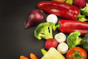 Freshly harvested organic vegetables on a wooden table. Vegetables on vintage wood background - autumn harvest. Rural still life from above with free text space.

