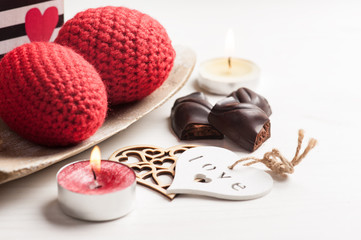 Red sparkling lit candle and dark chocolate