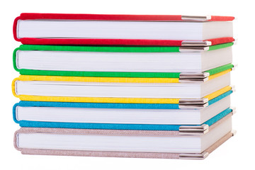 Multicolored book textile cover. Photobooks on a white background.