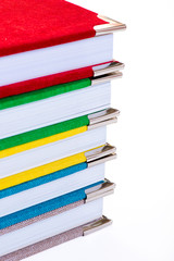 Multicolored book textile cover. Photobooks on a white background.