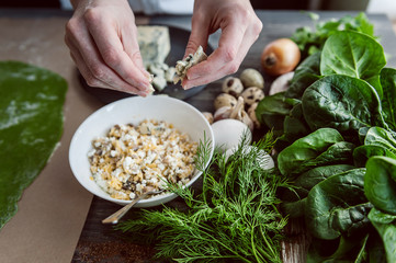 chef step by step, preparing a green ravioli