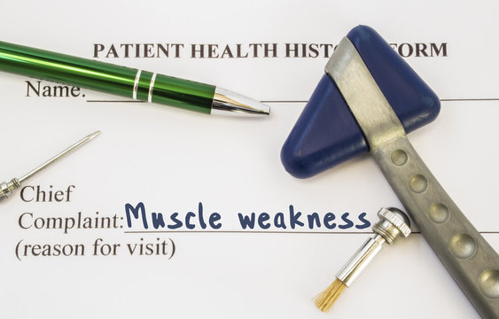 Complaint Muscles Weakness. Patient health history is on table of neurologist, which contains complaint Muscles Weakness surrounded by neurological hammer, tools to determine sensitivity of skin