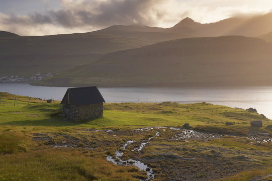 Streymoy mountains seen across Sundini sound, from near Eidi, on the north-west tip of Eysturoy, Faroe Islands (Faroes), Denmark