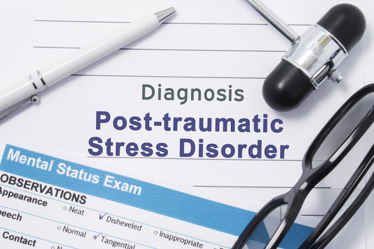 Diagnosis Posttraumatic Stress Disorder. Medical note surrounded by neurologic hammer, mental status exam with an inscription in large letters psychiatric diagnosis of Posttraumatic Stress Disorder