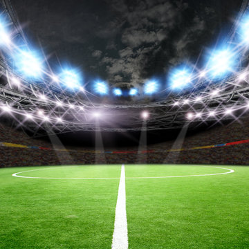 Soccer field with green grass and lights