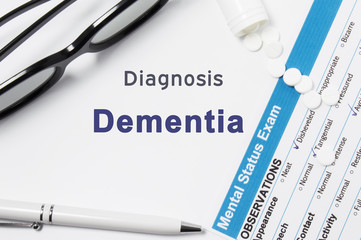 Diagnosis of Dementia. Results of mental status exam, container with crumbled pills with inscription psychiatric diagnosis Dementia on white background or white workplace psychiatrist or psychologist
