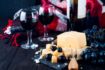 two glasses of red wine and cheese