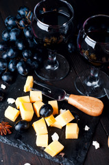 two glasses of red wine and cheese