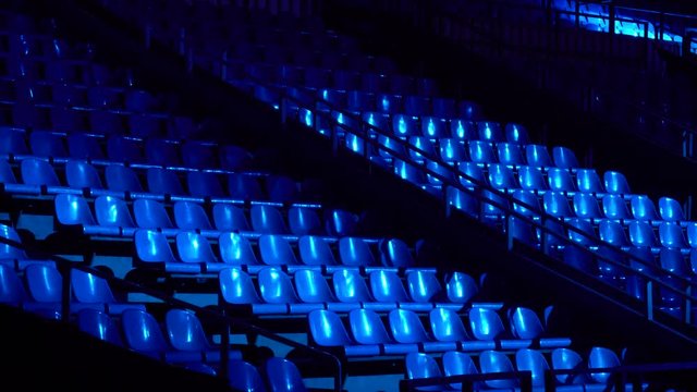 the seats in the concert hall with rays of light