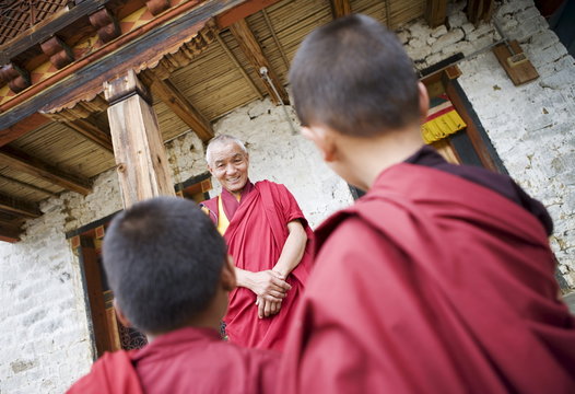 Buddhist lama teaching young monks, Karchu Dratsang Monastery, Bumthang, Bhutan