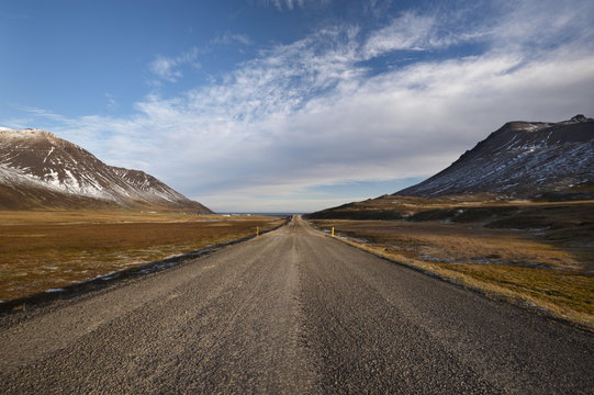 Road 94 in Njardvik valley, Borgarfjordur Eystri fjord in the distance, East Fjords area, Iceland