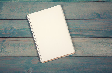 Blank notebook on wooden background