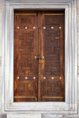 An old wood door with metal handle.