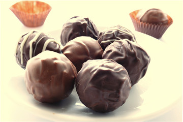 Handmade chocolates on white plate Image ID:533915773