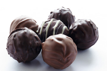 Handmade chocolates on a white background