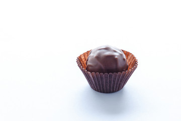 Handmade chocolates on a white background