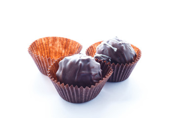 Handmade chocolates on a white background