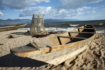 A fisherman tends his nets on Plage des Cocotiers (Coconut Beach) also known as Saga Beach, Lake Tanganyika, Bujumbura, Burundi