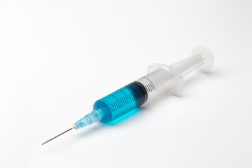 single syringe in white