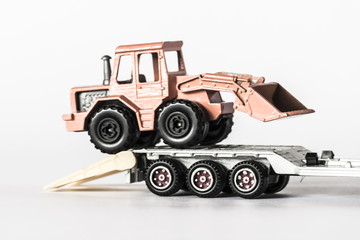 Caterpillar on truck's trailer