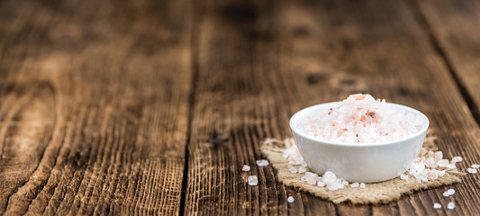 Wooden table with Pink Salt (selective focus)