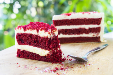 scene of red velvet cake was eaten on wood block and bokeh - can use to display or montage on product