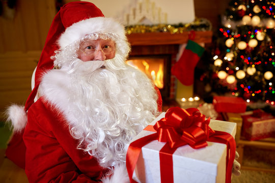 portrait Santa Claus with gift for you .