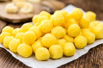 Cheese Balls on vintage wooden background