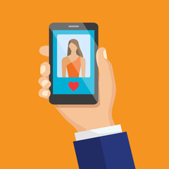  Hand holding smartphone with female image and heart icon. Meeti
